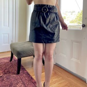 Slouchy biker leather mini skirt with belt buckle